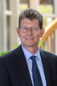 Man in suit with blurred face