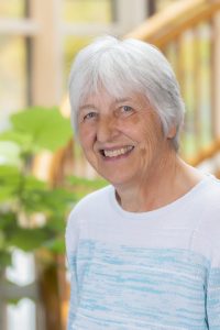 Elderly person with white hair.